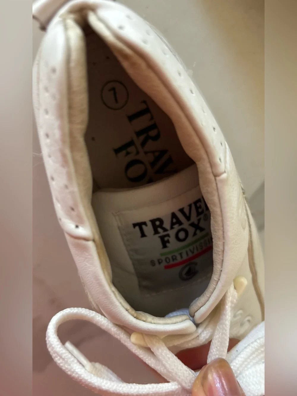 Travel Fox white sneakers size 7 back tab has a tear